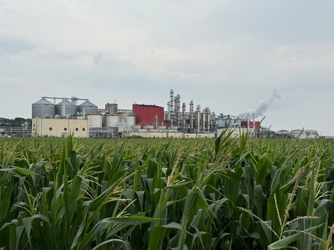 View of methanol and ethanol factory plant in corn field. Bioagra Goswinowice Ethanol Production Plant located near Nysa in Poland. Factory of bioethanol and ethanol produced from corn grain