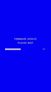 Vertical video of loading progress bar with on-screen text firmware update please wait on blue background