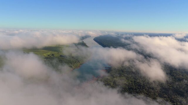 Sunbeams break through dramatic clouds above the Parana River between Argentina and Paraguay.