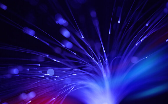Glowing blue optic fiber transmits digital data in the dark