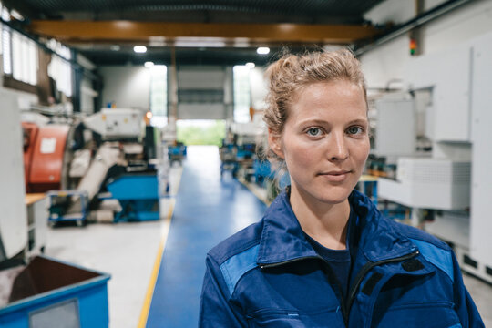Young woman working as a skilled worker in a high tech company, portrait