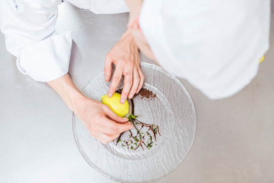 Junior chef prepairing a dessert plate