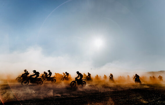 Group of motocross motorcycles coming out in the race