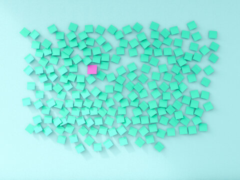 A single pink sticky note breaks the green pattern