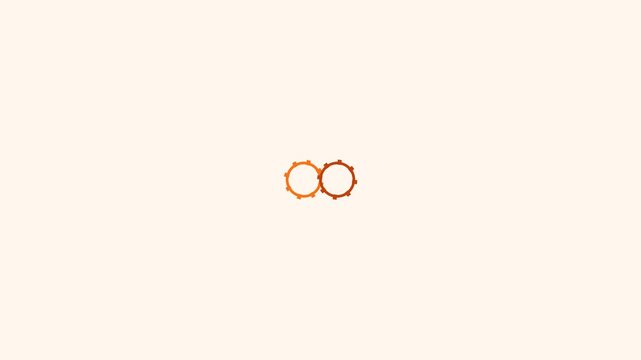 Two interconnected orange mechanical gears rotate in a seamless infinite loop animation for this digital motion graphics video clip project.