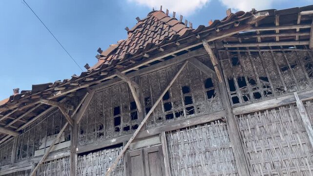 Traditional Javanese Village Wooden House Under Blue Sky