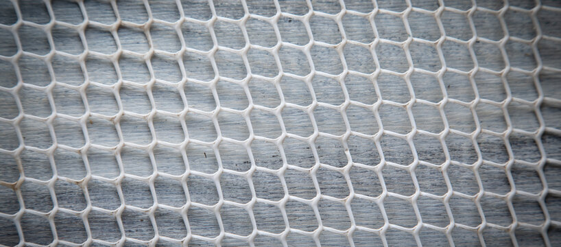 Plastic net structure on the table background.