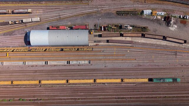 Close aerial view of a major railway junction and train maintenance yard in central Doncaster, UK