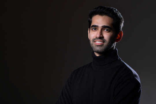 Portrait of a handsome young man looking at the camera