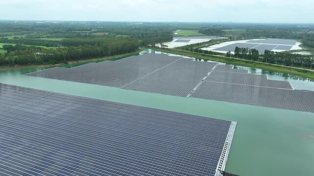 Drone photography captures a large floating photovoltaic system, demonstrating clean energy transition, ESG sustainability goals, and innovative solutions for maximizing unused water resources. 4k.
