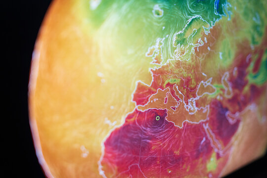 Close-up of a satellite thermal map showing severe temperature rise and overheating across the Mediterranean region. Concept of greenhouse effect, global warming, and climate emergency