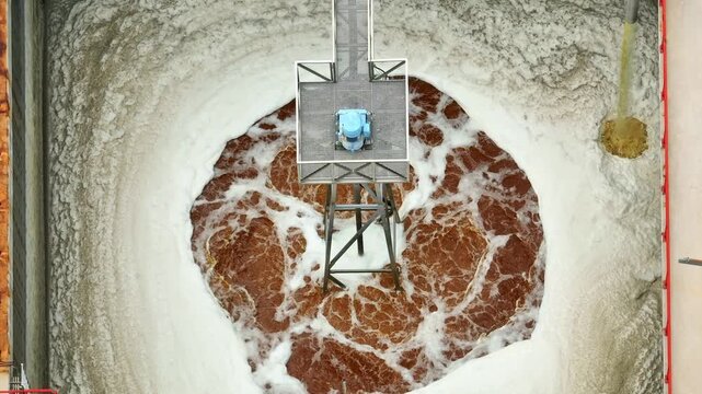 An industrial wastewater treatment basin showing continuous purification, where advanced engineering neutralizes pollution threats and restores environmental balance through controlled processes. 4k.

