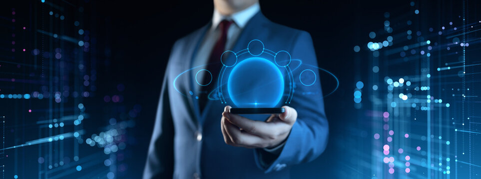 A businessman holds a smartphone. Business Technology Concept