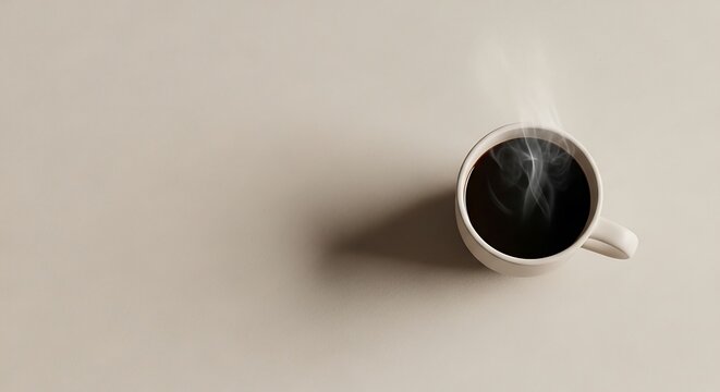 A steaming cup of black coffee on a minimalist surface