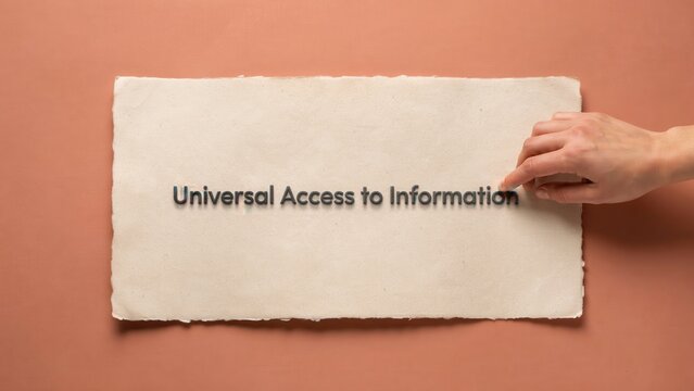 Symbolic representation of knowledge democratization a hand arranging a parchment bearing a message of open information for all