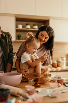 Happy family baking together in kitchen