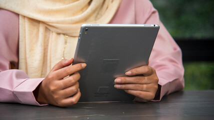 Muslim women working. Muslim woman wear hijab work from home office typing laptop keyboard on...