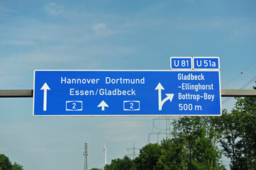 Fototapeta premium Highway Sign: Hannover, Dortmund, Essen, Gladbeck, Ellinghorst, Bottrop-Boy 2, Germany