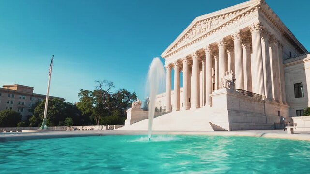 Government Courthouse Exterior with Water Fountain and American Flag 4k Video Classical Architecture Stone Columns Public Plaza Pedestrians Walking Near Neoclassical Building