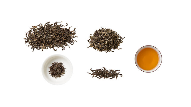 Dried green tea leaves and brewed tea in cup