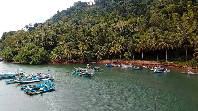 Traditional Fishing Boat Entering River Estuary &ndash; Coastal Fishermen Returning to Harbor