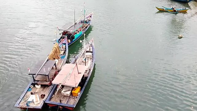 Traditional Fishing Boat Entering River Estuary &ndash; Coastal Fishermen Returning to Harbor