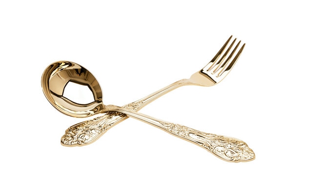 Ornate gold ladle and fork crossed with decorative handles
