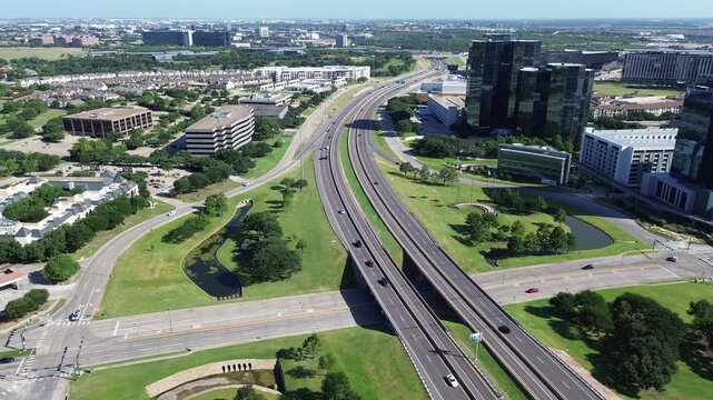Sprawling office complexes occupy manicured green space adjacent to transportation arteries. Efficient corporate site planning remains essential for Las Colinas, Irving, TX economic growth