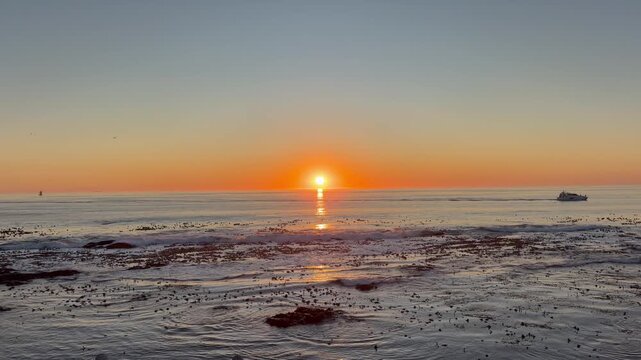 Sunset over the South Atlantic Ocean Sea Point, Cape Town, South Africa.