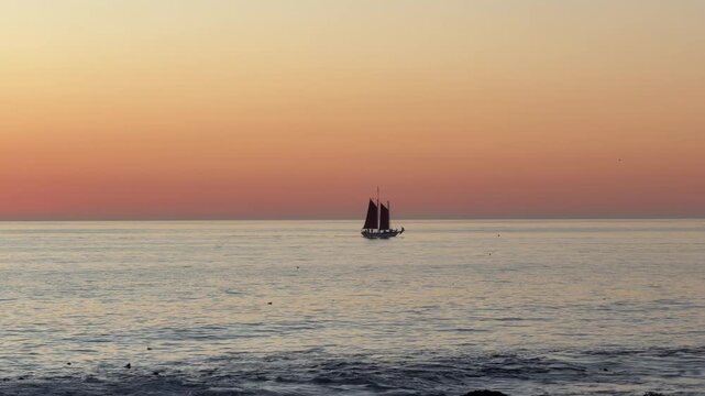 A boat in the distance during a sunset in Cape Town, South Africa