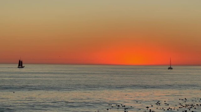 The orange glow of a beautiful sunset over the South Atlantic Ocean near Cape Town, South Africa.