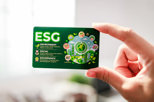 Hand holding a green esg card environment, social and governance ideas for sustainable business