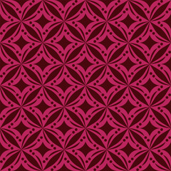 Fototapeta premium Seamless geometric pattern with stylized floral motifs in shades of pink and red.
