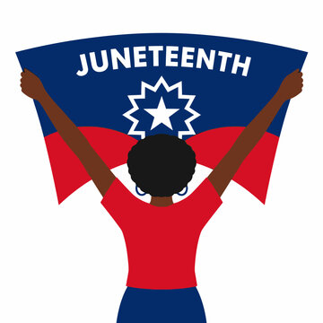 Black woman holding Juneteenth flag high to celebrate African American freedom and heritage.