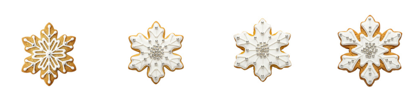Four decorative snowflake gingerbread cookies isolated on black background