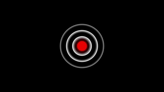 Red circle with white concentric rings glowing on a black background representing a recording indicator or a target focus point for digital media