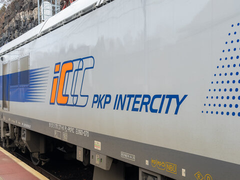Szklarska Poreba, Poland - December 21, 2025: PKP Intercity locomotive side panel showing branding on a modern electric train parked at a station platform for rail travel