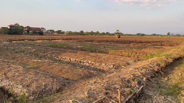 Traditional farming machinery preparing soil for planting season