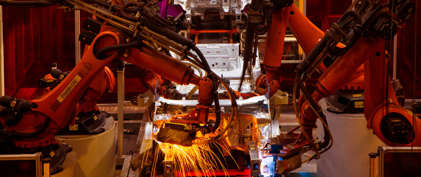 Automated production line with robotic arms in automobile manufacturing plants
