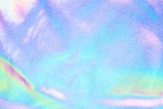 Holographic iridescent pastel texture background with soft shimmer and rainbow gradient