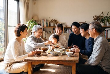 Fototapeta premium Three Generations Sharing A Homemade Meal At A Wooden Dining Table