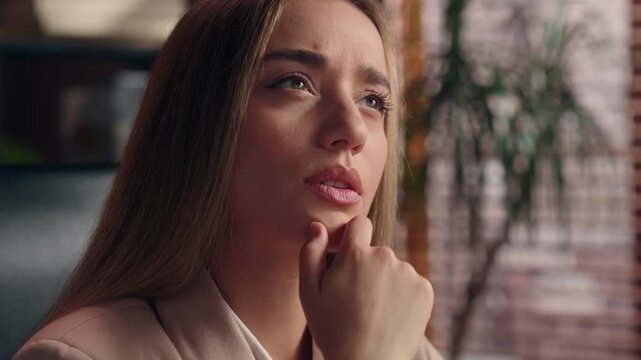 Caucasian focused thinking Caucasian business woman come up with idea smiling happy looking at camera concentrated businesswoman think finding insight excited smile female girl consider plan at office