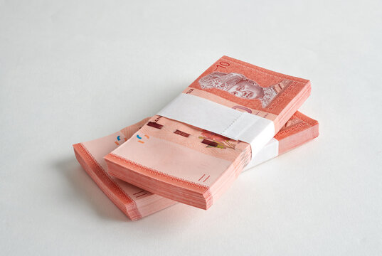 Bundles of Malaysian Ringgit Banknotes Isolated on White Background