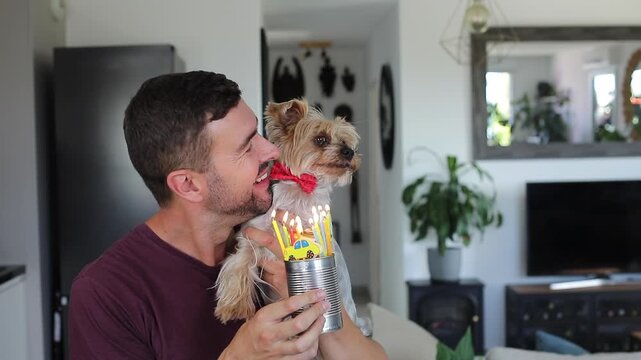 Man celebrating his dog&acute;s birthday