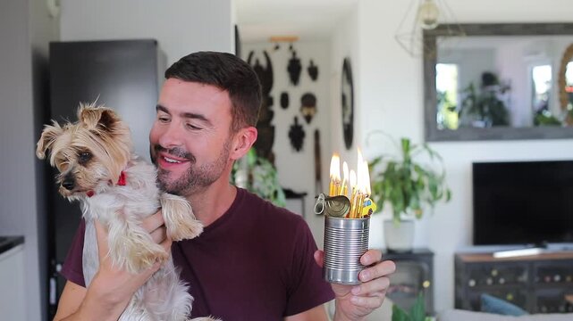 Man celebrating his dog&acute;s birthday