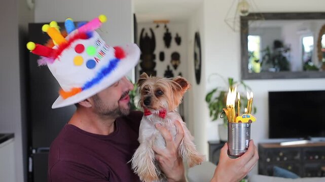 A man celebrating the birthday of his dog 