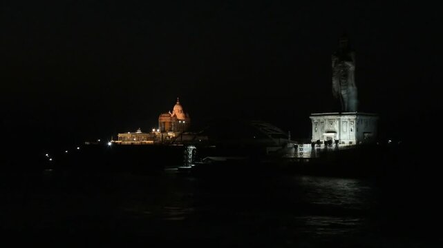The night view of illuminated Vivekananda Rock Memorial and nearby structures from the mainland | Kanyakumari, Tamil Nadu, India