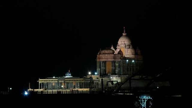 The night view of illuminated Vivekananda Rock Memorial and nearby structures from the mainland | Kanyakumari, Tamil Nadu, India