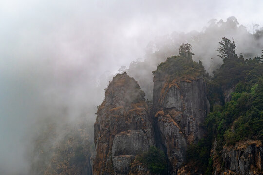 Pillar rocks in fog at Kodaikanal, Kerala, india