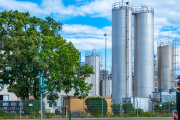 Fototapeta premium chemical storage tank, Industrial Chemiekonzern, plant, manufacturing and innovation, European industrial facility, Energy and Production, various tanks silo, Environmental Integration